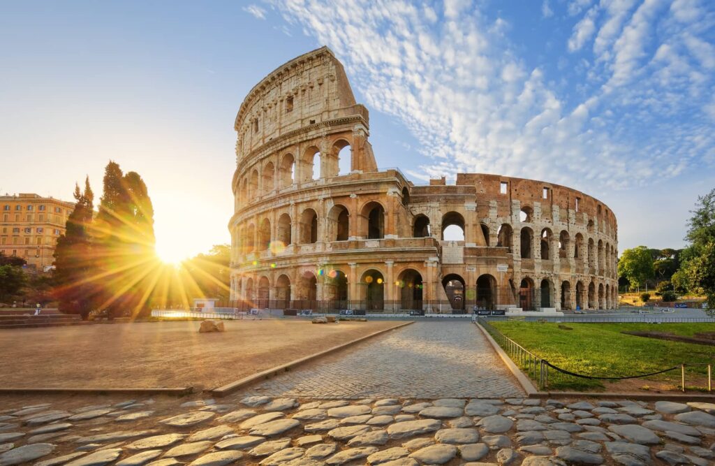 View of Colosseum in Rome and morning sun, Italy, Europe.