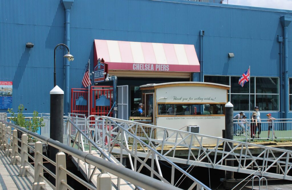 Marina view of Chelsea Piers recreational building and boat dock